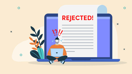 Illustration of a panicked man sitting in front of a large laptop and rejection letter