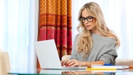 woman researching company on laptop