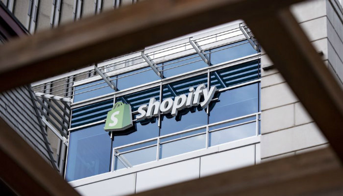 The Shopify logo on the side of a building