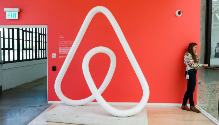 A sculpture of the Airbnb logo