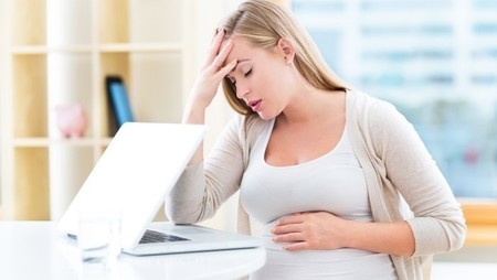 tired pregnant woman worker requires medical leave