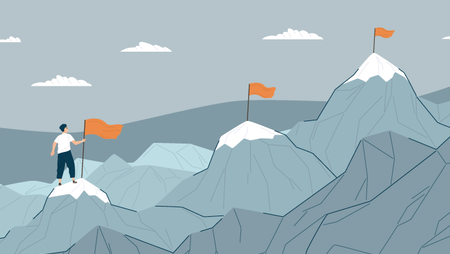 worker on mountain with flags setting career goals
