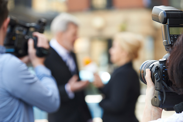 Broadcaster on camera.