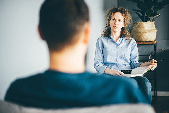 Social worker working with a client.
