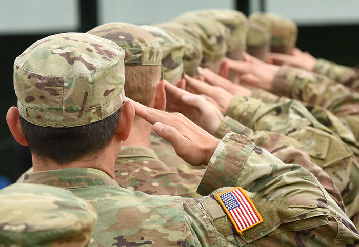 American soldiers saluting.