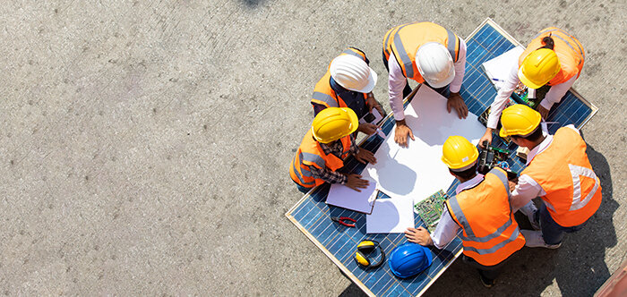 Solar energy foreman engineer directing team on site