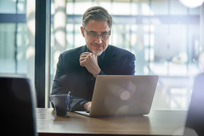 Talent agent sitting in front of a laptop