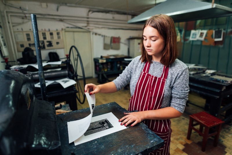 Print maker working on a print