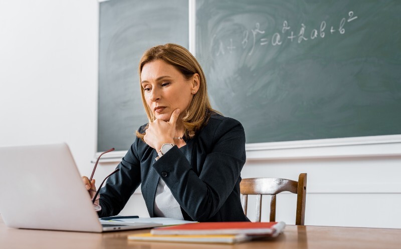 Teacher Using Computer Skills